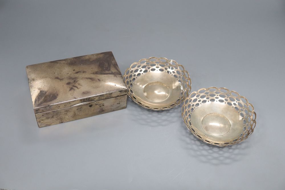 A pair of silver bon-bon dishes, A & J Z, Birmingham 1910, 5.1oz. and a Chinese white metal cigarette box marked LH 90, 16cm (3)